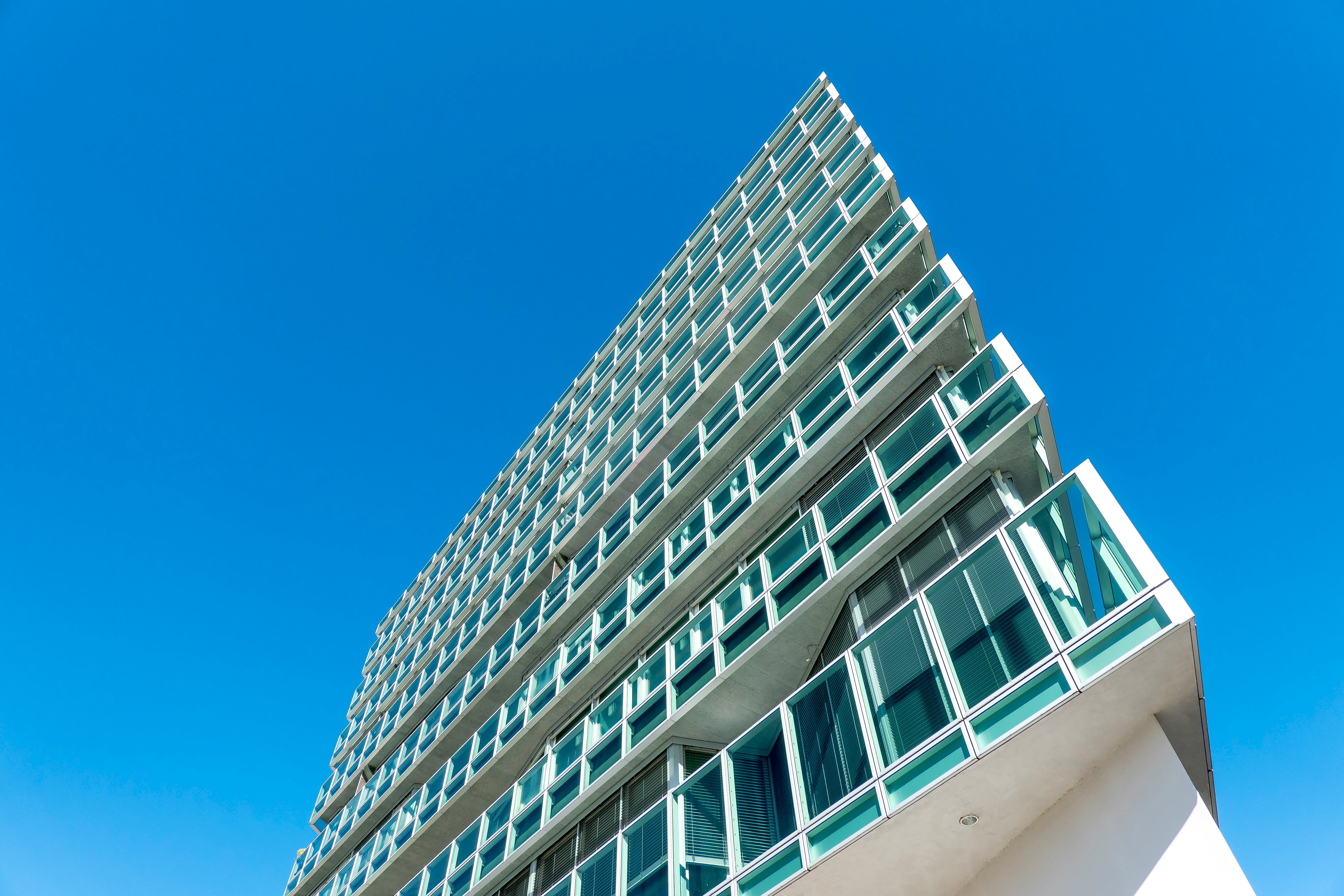 white concrete building under blue sky during daytime